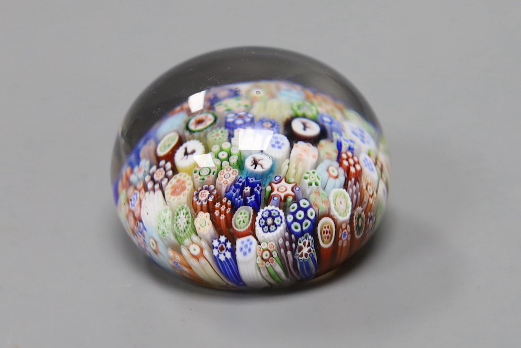 A Baccarat millefiori paperweight, with dog, huntsman and cockerel silhouette canes, 4cms wide